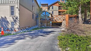 A multi-story building with a mix of residential and commercial spaces, including a visible staircase and a covered area. - Breck Ski-in/ski-out Condo on Peak 8 w/ Patio (Breckenridge)