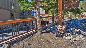 A wooden sign with a mountain silhouette, a wooden fence, and a stone pathway. - Breck Ski-in/ski-out Condo on Peak 8 w/ Patio (Breckenridge)