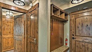A wooden elevator with a fire extinguisher mounted on the wall. - Breck Ski-in/ski-out Condo on Peak 8 w/ Patio (Breckenridge)