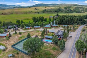 A rural property with multiple cabins, a swimming pool, and a road. - Knapsack- Newly updated mountain cabin! (Clark)
