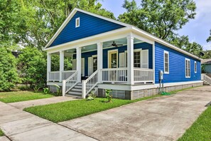 A two-story house with a blue exterior, white porch, and a covered front porch area. - 2 Mi to Dauphin St! Charming Home in Mobile (Mobile)