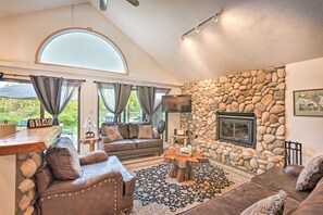 House (3 Bedrooms) | Living area | TV, fireplace, books - Secluded Bass Lake Cabin, 9 Mi. to Traverse City! (Traverse City)