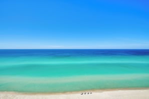 A beach with clear turquoise water and a sandy shore. - Ocean View Condo Btwn Rosemary & Alys Beach! (Panama City Beach)