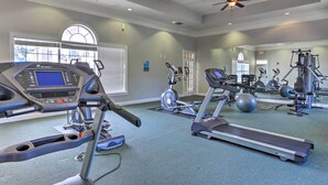 A gym with treadmills, an elliptical, and free weights. - Sun-soaked Kissimmee Gem w/ Resort Amenities! (Kissimmee)