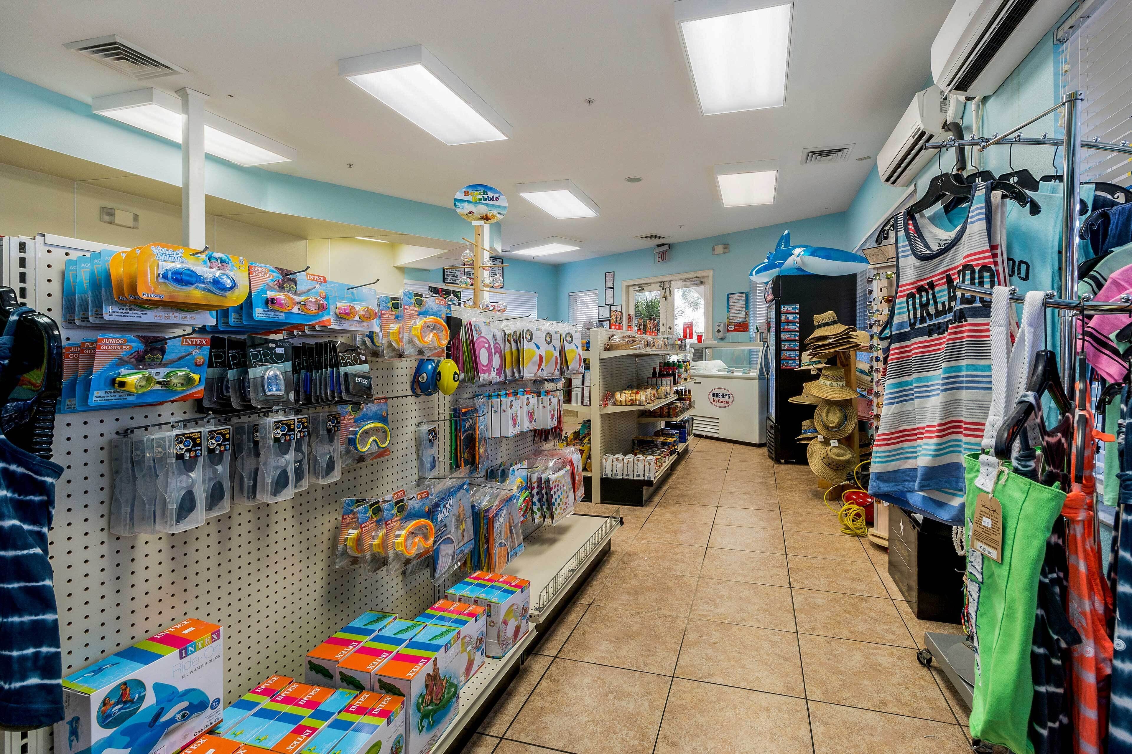 A store with shelves stocked with toys, games, and children's clothing.