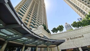 A high-rise building with a modern architectural design, featuring a prominent entrance with a canopy and the name "29 Boulevard" visible on the facade. - Silkhaus 29 Boulevard, Downtown Dubai (Dubai)