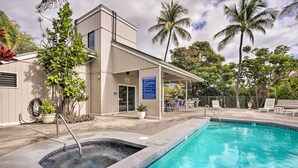 A pool area with a hot tub, lounge chairs, and a covered seating area. - Top-floor Kailua Bay Resort Condo w/ Ocean Views! (Kailua-Kona)
