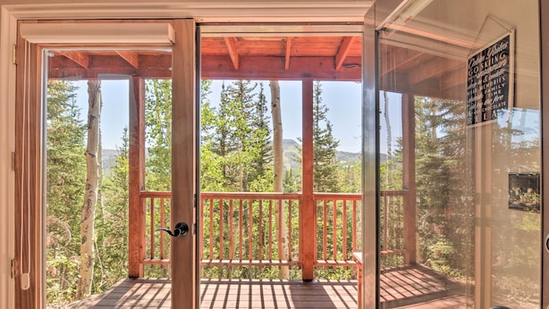 A wooden deck with a glass door leading to a forested area. - < 1 Mi to Brian Head Resort: Mtn-view Gem w/ Deck (Brian Head)