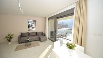 Deluxe Apartment, 1 Queen Bed with Sofa bed, Balcony, Bay View | Living area | 55-inch Smart TV with digital channels, TV, Netflix