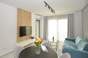 Deluxe Apartment, 1 Queen Bed with Sofa bed, Balcony, Bay View | Living area | 55-inch Smart TV with digital channels, TV, Netflix - Solaris Lux Apartments (Kotor)