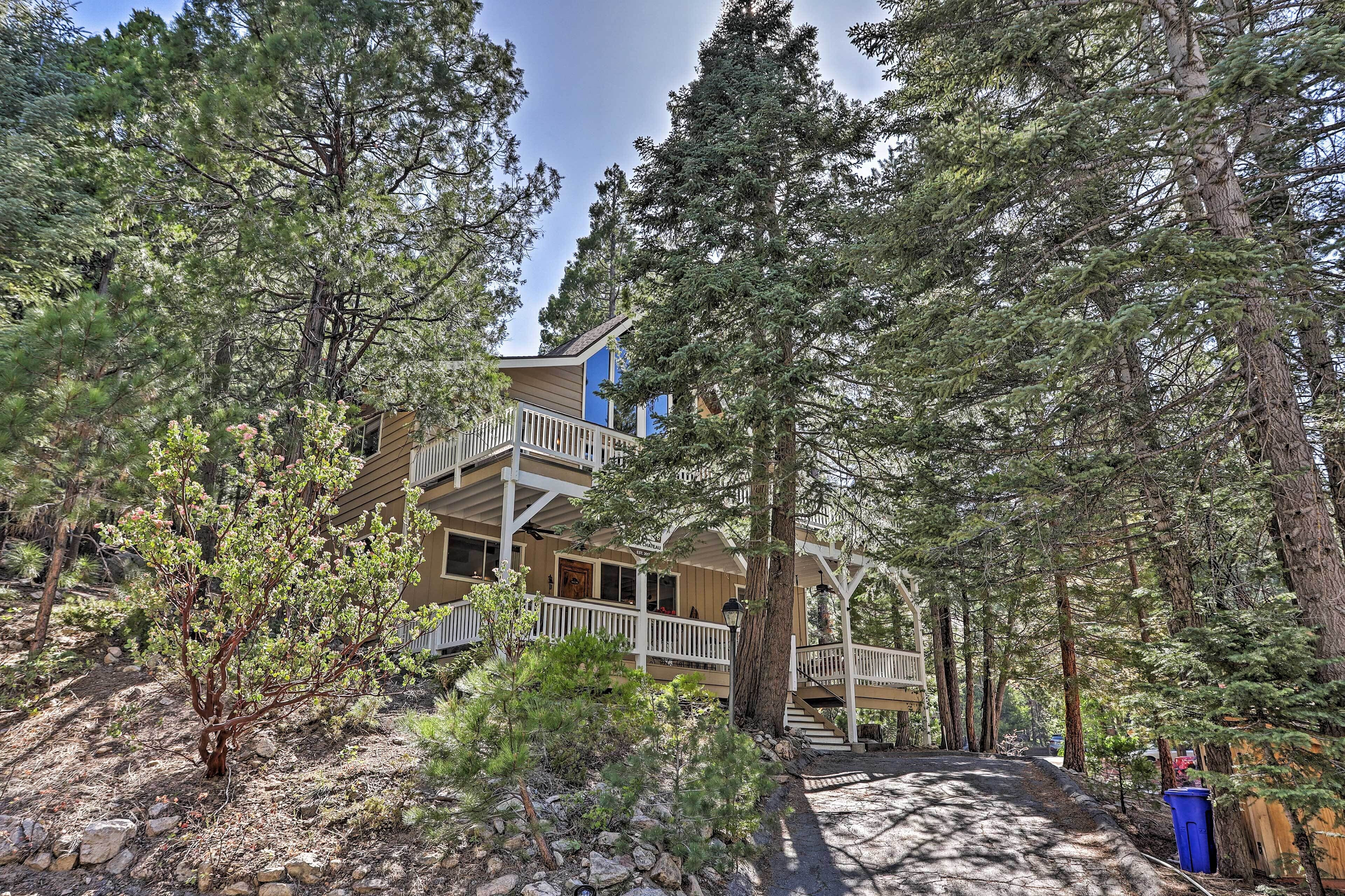 A two-story building with a balcony and a staircase leading to the upper level.