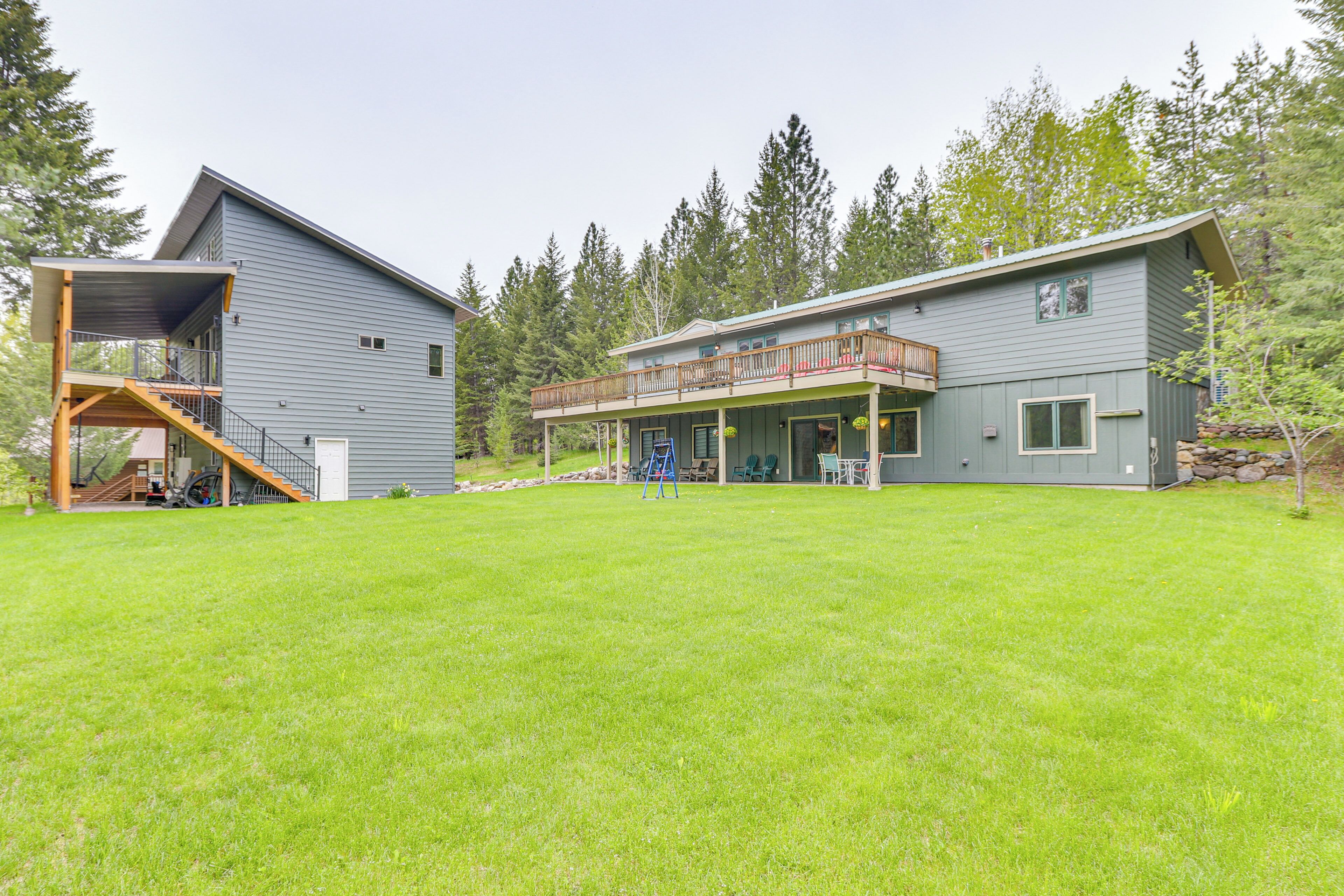 A two-story house with a covered porch and a separate garage.