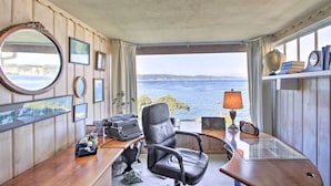 A room with a desk, chair, and a view of the sea. - Gas Fire Pit, Views & Beach Access: Waterfront (University Place)