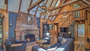 A cozy living room with a fireplace, leather furniture, and a wooden ceiling. - Lakeview Lodge Fit for Groups < 1 Mile to Lake! (Cedar Glen)