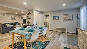 A modern apartment with a dining area, living room, and kitchen. - Martha's Vineyard Apt ~ 1 Mile to Inkwell Beach! (Oak Bluffs)