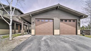 A two-story house with a garage, a covered porch, and a tree in the driveway. - 2 Mi to Donner Lake: Walkable Truckee Condo! (Truckee)