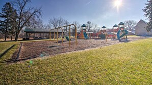 A playground with swings, slides, and climbing structures.