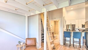 A modern interior with a kitchen, a staircase, and a seating area. - 5 Mi to Ski Resort: Breck Penthouse Studio (Breckenridge)