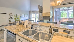 A modern kitchen with granite countertops, stainless steel sinks, and a built-in oven. - 5 Mi to Ski Resort: Breck Penthouse Studio (Breckenridge)