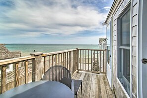 A wooden deck with a view of the ocean. - Harbor Views + Private Deck: Waterfront P-town Apt (Provincetown)