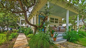 A covered porch with a wooden walkway leading to a house. - Seagrove Beach Studio - 1/4 Mi to Beach Access! (Santa Rosa Beach)