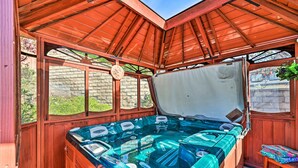 A hot tub with a wooden roof and large windows, surrounded by a wooden deck. - Chula Vista Studio w/ Hot Tub ~ 9 Mi to Downtown (Chula Vista)