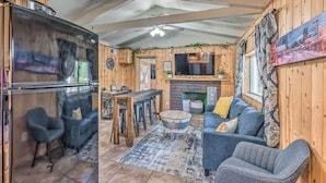 A cozy cabin interior with a kitchen, dining area, and living room. - Cabin w/ Mountain Views ~ 2 Mi to Ruidoso Midtown! (Ruidoso)