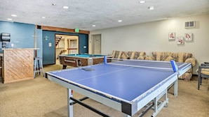 A room with a ping pong table, a pool table, and a sofa. - All-season Resort Condo: 5 Mi to Dillon Reservoir (Silverthorne)
