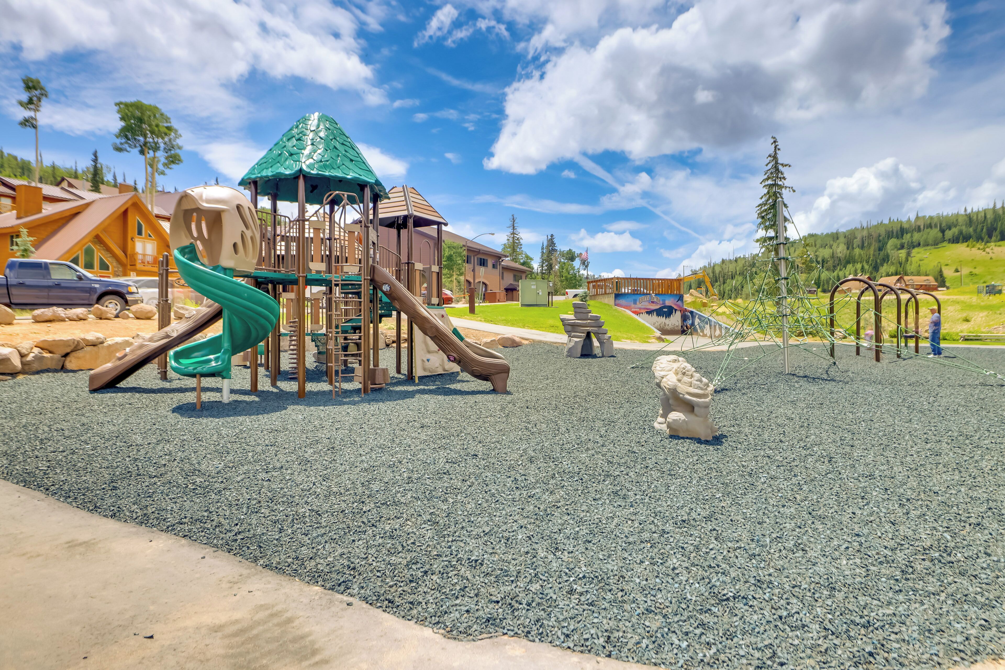 A playground with a slide, climbing structures, and a ball pit.
