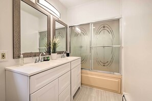 A modern bathroom with a double sink, a large mirror, and a glass shower enclosure. - Deck & Backyard: Tobyhanna Family Home (Tobyhanna)