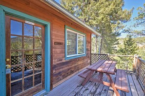 A wooden cabin with a "No Smoking" sign, a wooden deck, and a picnic table. - Cabin w/ Mtn Views - 5 Mi to Mueller State Park! (Divide)