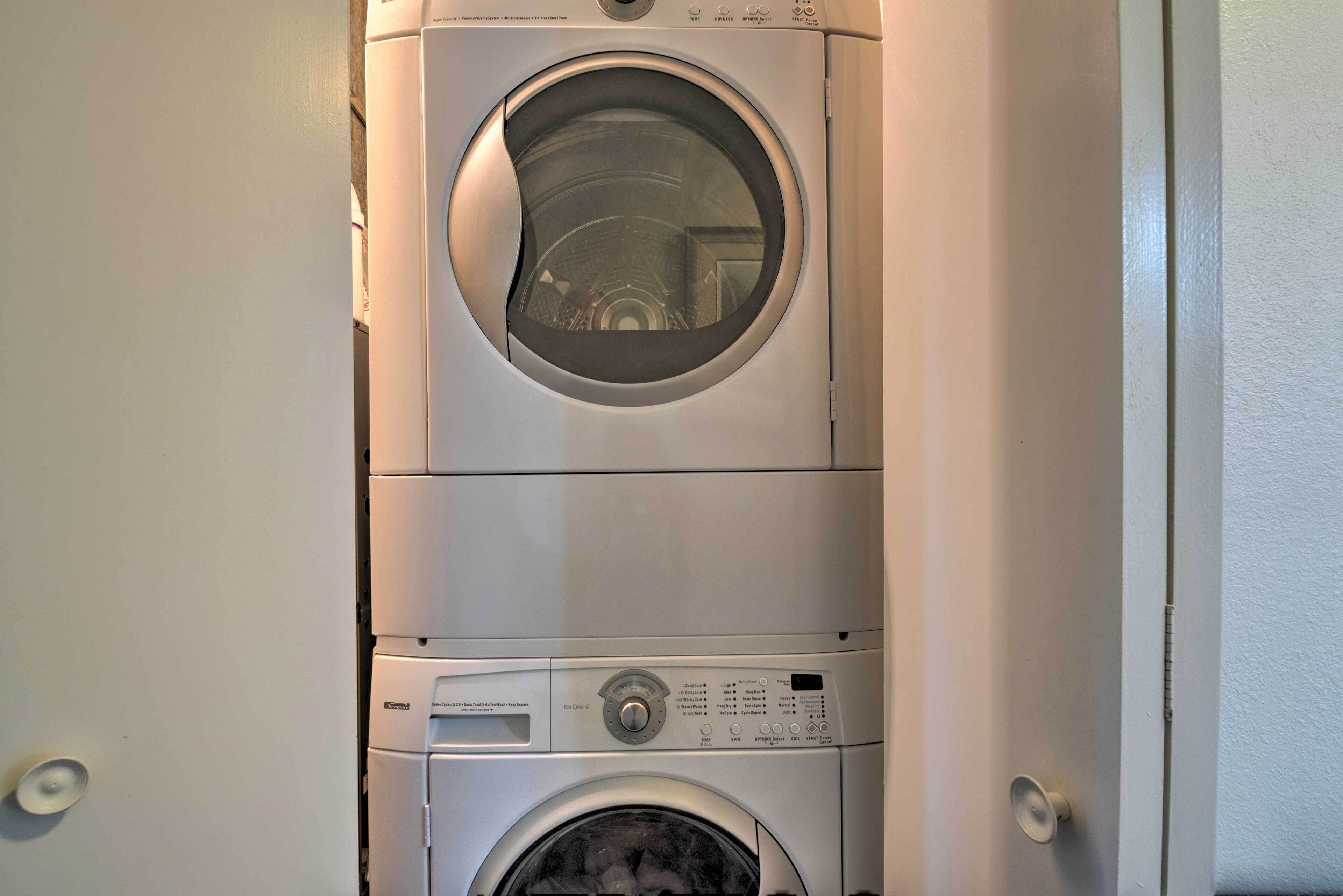 A front view of a stacked washer and dryer unit.