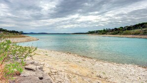 A river with a rocky shoreline and distant hills. - Canyon Lake Getaway w/ Fire Pit, Boat Ramp Nearby! (Canyon Lake)