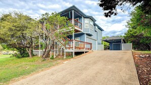 A two-story house with a front porch and a covered entryway. - Canyon Lake Getaway w/ Fire Pit, Boat Ramp Nearby! (Canyon Lake)