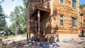 A wooden cabin with a covered porch, a staircase, and a number '5127' sign. - Inviting Ski Getaway < 1 Mile to Northstar Resort! (Truckee)