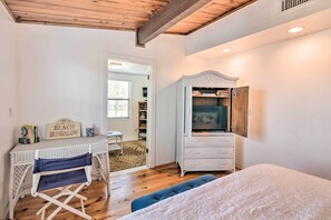 Cozy retreat with a comfortable bed, TV, and desk for a relaxing stay.