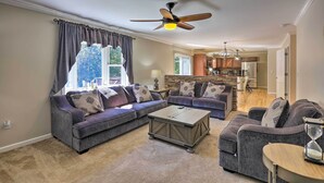 A living room with a sofa, armchairs, a coffee table, and a ceiling fan. - Poconos Escape w/ Hot Tub & Fire Pit (Albrightsville)
