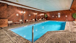 An indoor swimming pool with wooden walls and tiled flooring. - Hike, Ski, Explore: Lincoln Condo w/ Pool Access (Lincoln)