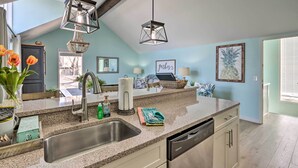 A modern kitchen with granite countertops, stainless steel appliances, and pendant lighting. - Lake View! Family Resort Retreat in Osage Beach (Osage Beach)