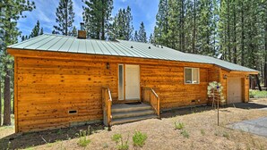 A wooden cabin with a metal roof, a front door, and a small porch. - 4 Mi to Heavenly: Home w/ Deck in South Lake Tahoe (South Lake Tahoe)