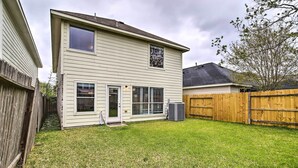 A two-story house with a well-maintained lawn and a wooden fence. - Spacious Houston Getaway < 18 Mi to Downtown! (Houston)