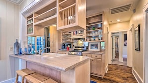 A kitchen with wooden cabinetry, a central island, and a built-in oven. - 2 Mi to Hot Springs Nat'l Park: Hot Tub Haven! (Hot Springs)