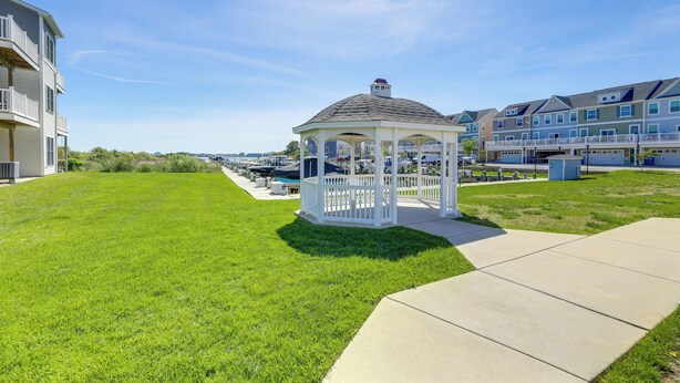 A gazebo in a grassy area with a clear sky. - Boat Slip & Pool Access: Ocean City Home! (Ocean City)