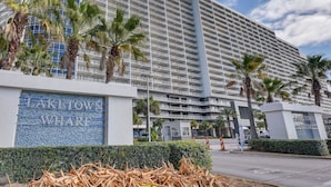A modern hotel with a large, multi-story structure and a prominent sign reading "LAKETOWN WHARF".