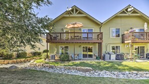 A two-story house with a balcony, outdoor seating, and a patio area. - Pagosa Springs Home w/ Deck & Grill, Walk to Town! (Pagosa Springs)