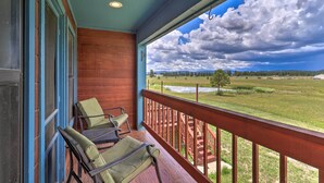 A porch with wooden railings and two green cushioned chairs. - Peaceful Pagosa Springs Escape ~ 2 Mi to Lake (Pagosa Springs)