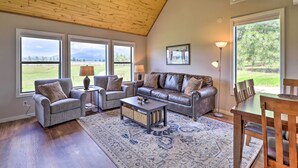 A spacious living room with a high ceiling, large windows, and a view of the outdoors. - Peaceful Pagosa Springs Escape ~ 2 Mi to Lake (Pagosa Springs)