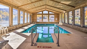An indoor swimming pool with wooden beams, large windows, and a 'No Diving' sign. - Cozy Studio w/ Balcony, Walk to Brian Head Resort! (Brian Head)