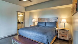 A bedroom with a bed, bedside tables, a bench, and a ceiling fan. - Upscale Moab Townhome w/ Hot Tub: 20 Min to Arches (Moab)