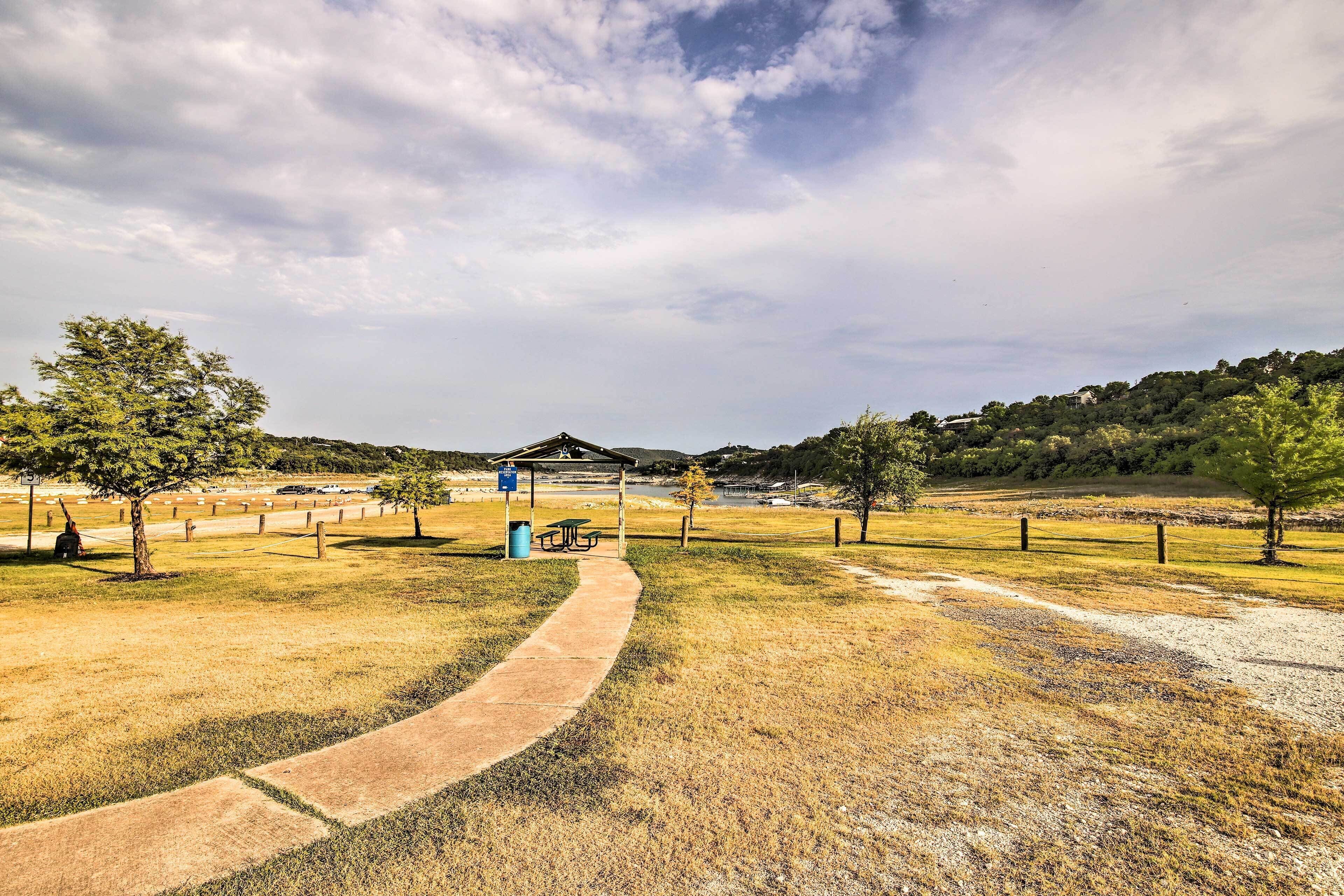 A park with a picnic area, a shelter, and a walking path.